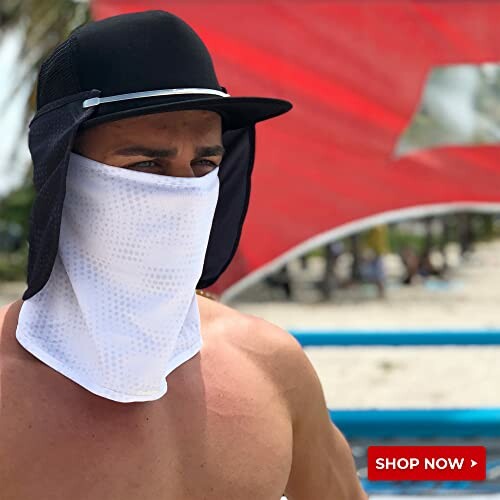 Person wearing sun protection gear at the beach